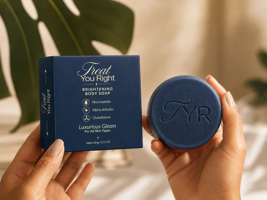 Dua tangan memegang kotak kemasan dan sabun batang Body Soap Treat You Right.